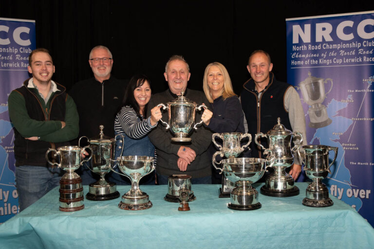 John Lensen with his family celebrating hi sKings Cup Win with his aul of silver ware